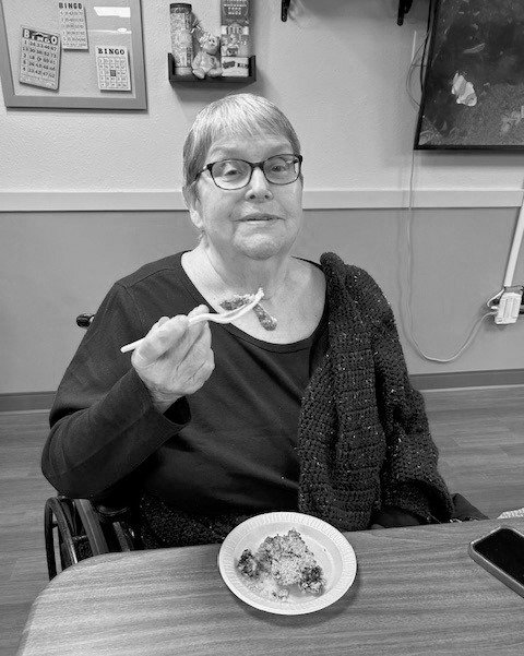 Lorraine enjoying some kitty litter cake. Kelsey took a break from her pan-