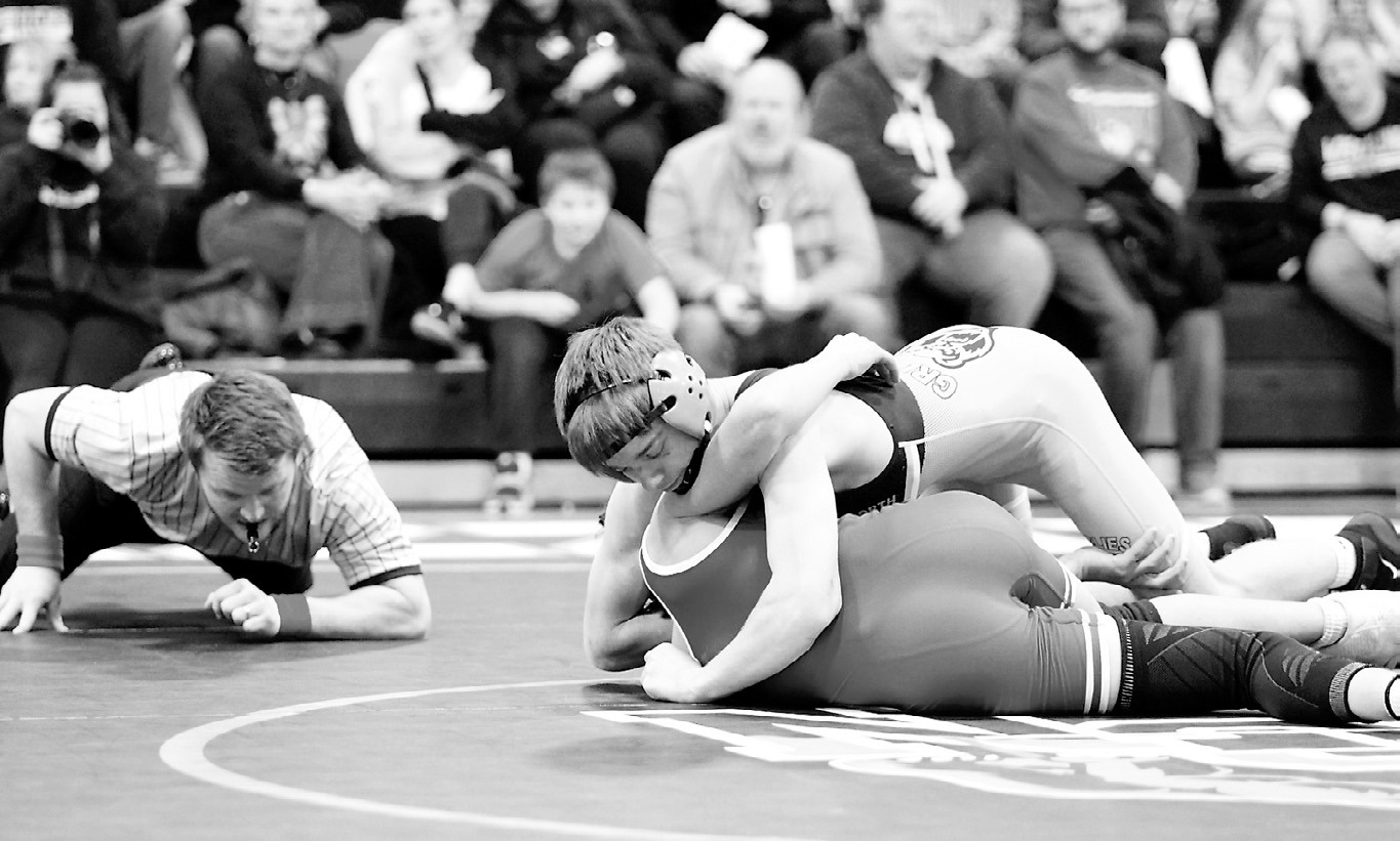 Oakley Brown in the 133-pound weight class pinned his Hillsboro opponent to win his match in Cavalier on Dec. 16. Photo by Larry Stokke.