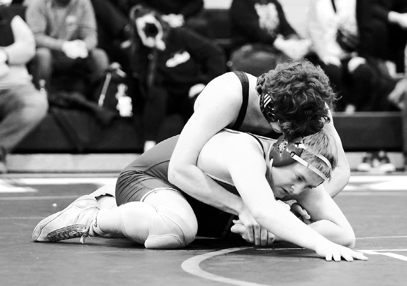 Bryce Carigan pinned HCV's Cade Mueller in the 215-pound weight class. Photo by Larrry Stokke.