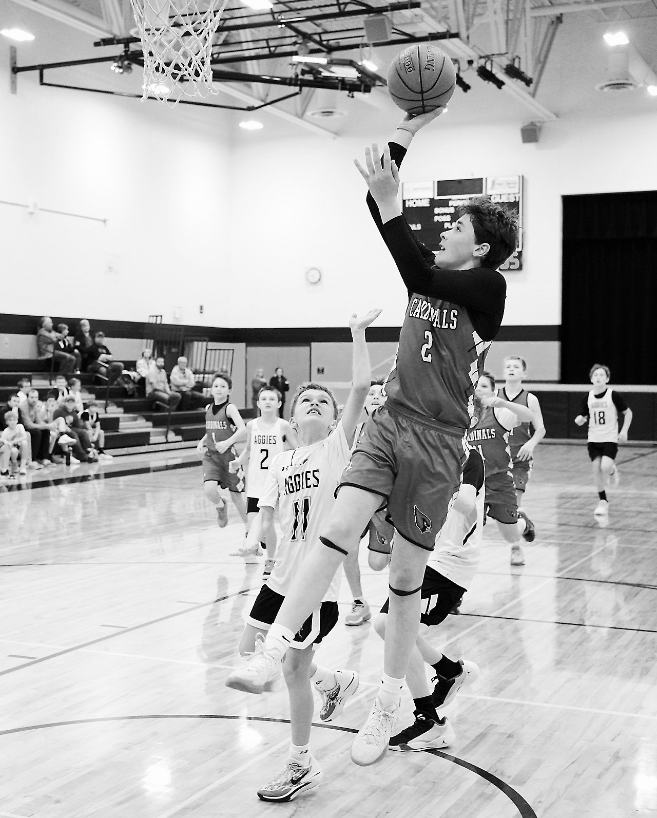 Kyler Hanson drops in two points in the Cards' win over the Park River Aggies. Photo by Larry Stokke.