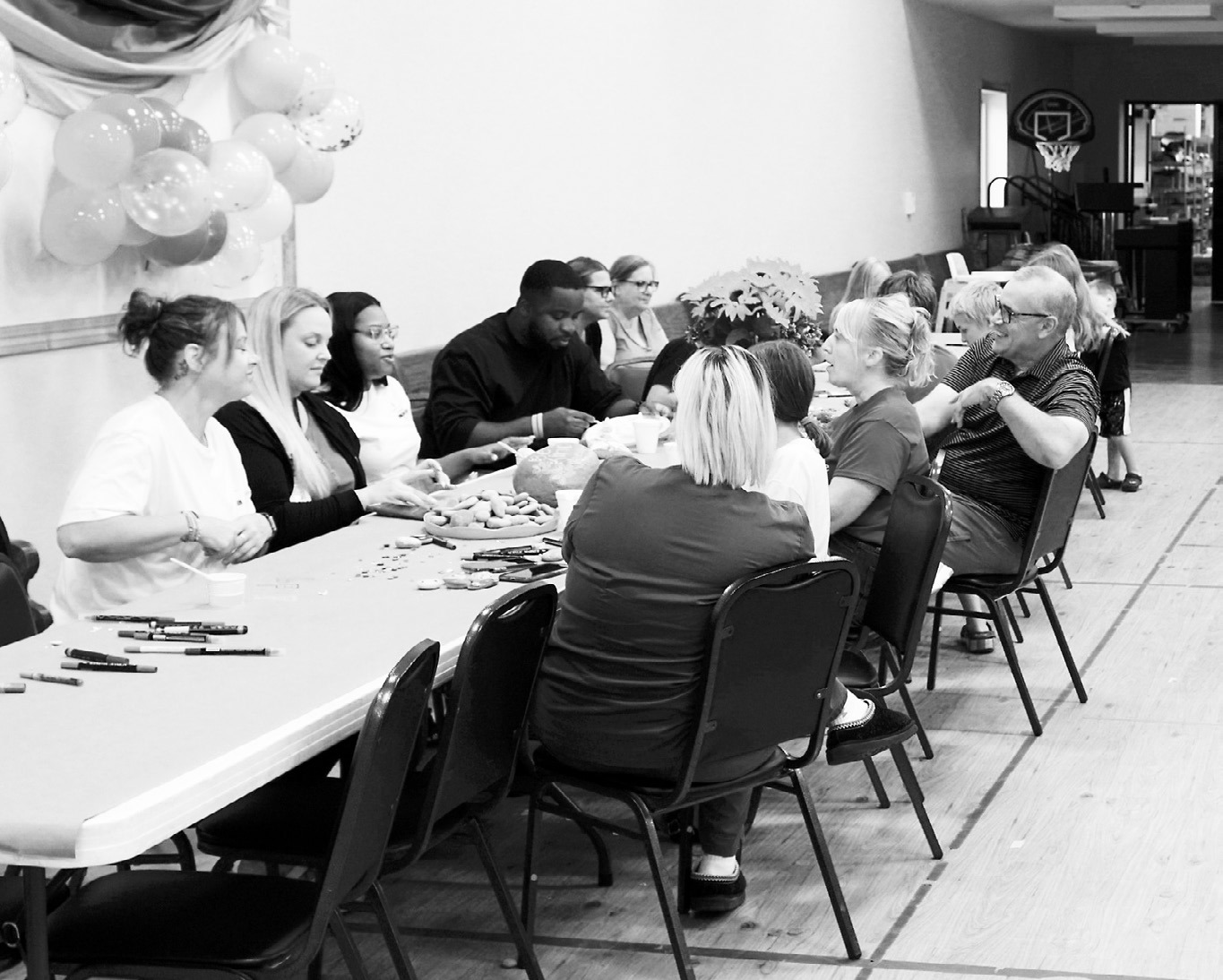 Attendees enjoy painting inspirational messages and words on rocks at the annual LPH Foundation Picnic. Photo by Larry Stokke.