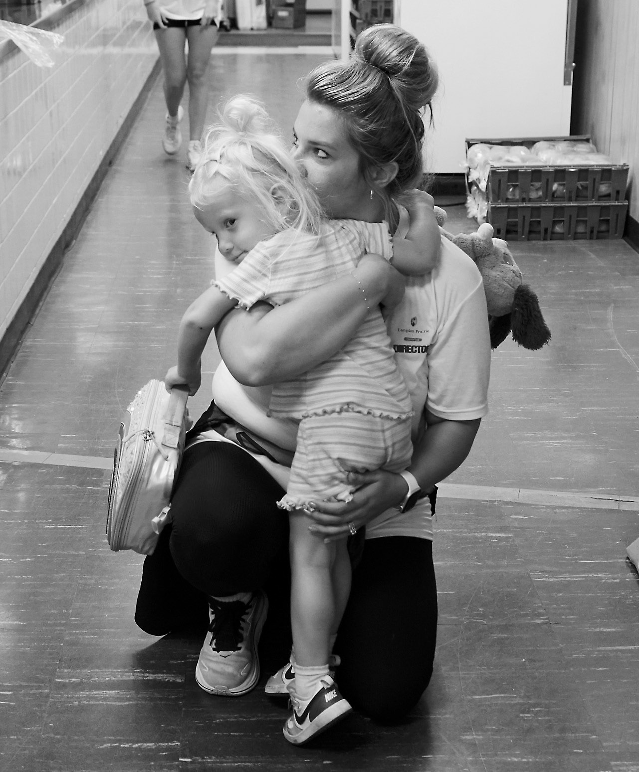 McKinzie Siverston, director of the LPH Foundation, holds her daughter at the annual picnic. Photo by Larry Stokke.