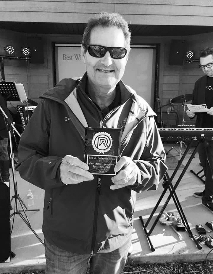 Pat Chaput, president of the Pembina Gorge Foundation, holds their Best Winter Recreation award for Frost Fire Park. Photo by Shirley Burns.