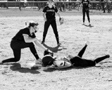 Nora Lorenz beats the tagout at 3rd base in the win against the Nelson County Chargers. Photo by Larry Stokke.