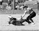 Raeleigh Ratzlaff tags out the Nelson County Charger at second base in Langdon on May 9. Photo by Larry Stokke.