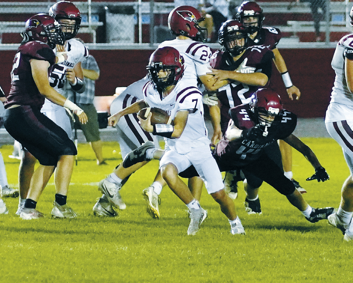 Connor Mitchell came in as quarterback in the 4th quarter and carried the ball forward for a first down. Photo by Larry Stokke.