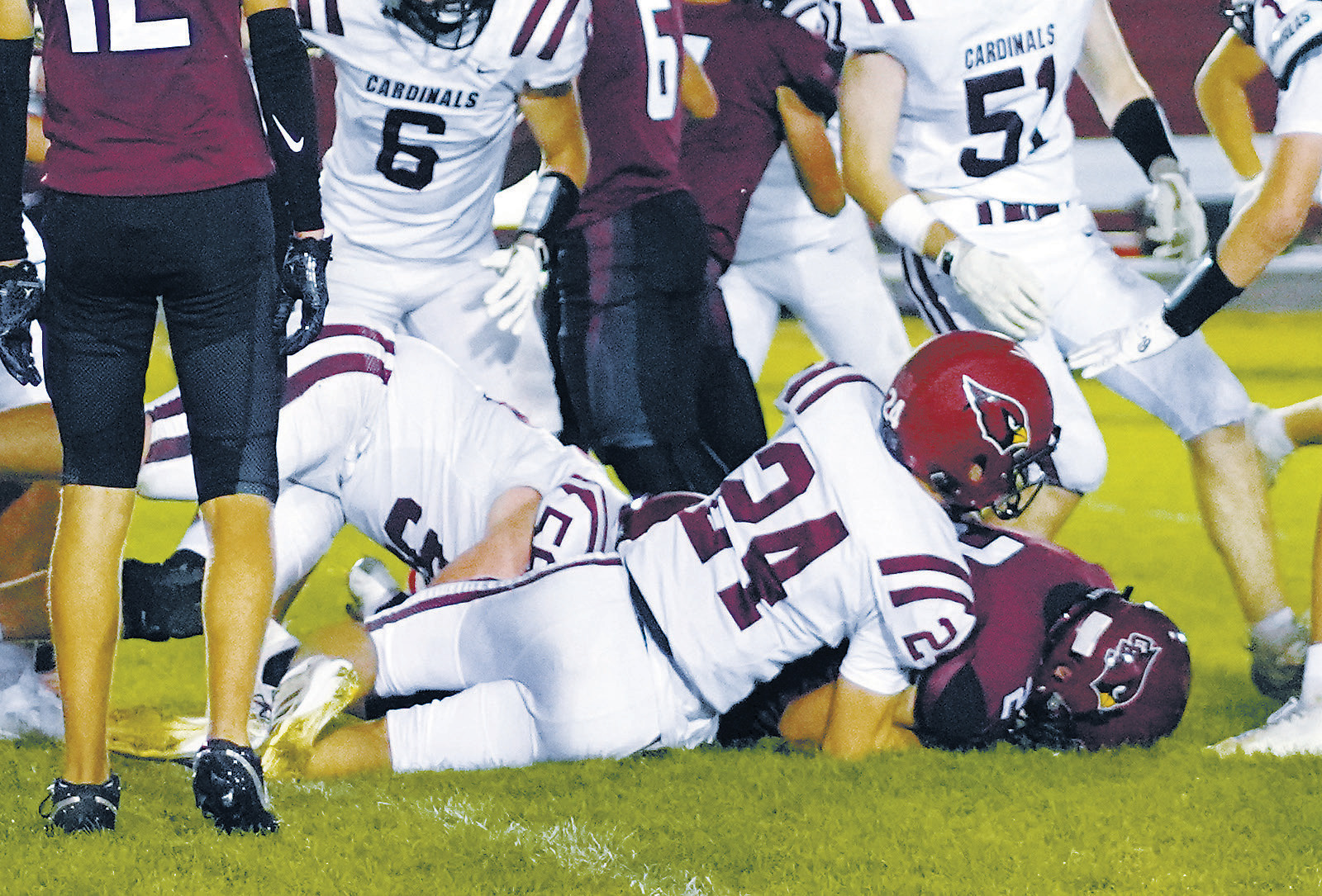 Evan Ottem and Dawson Downs take down a Carrington ball carrier in the Cards' win last Friday night. Photo by Larry Stokke.