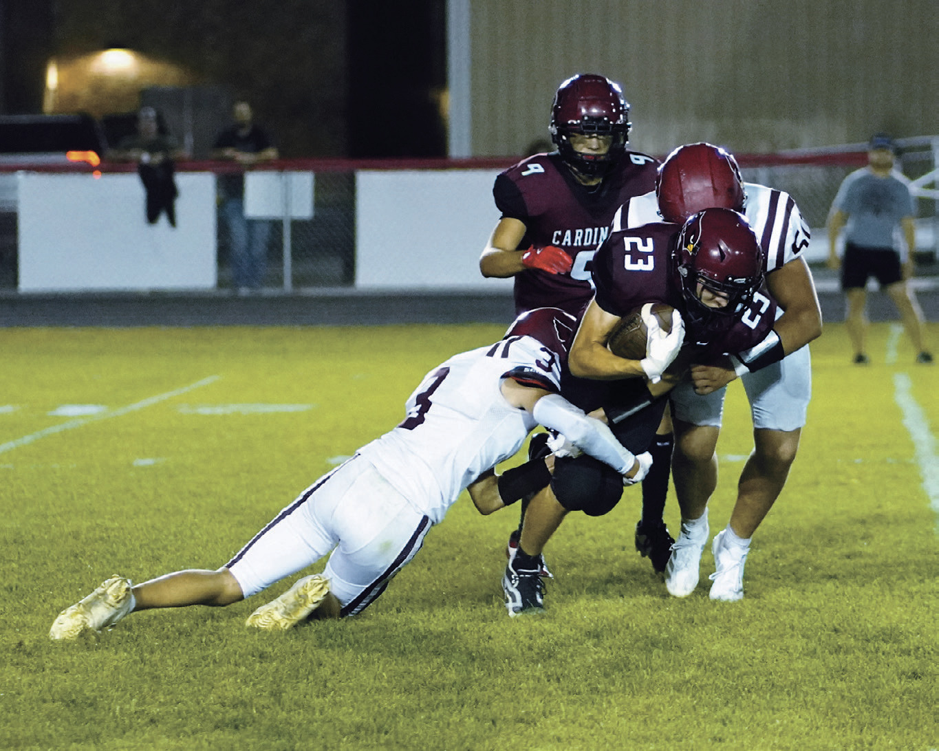 TJ Henderson and Landon Schneider team up to tackle the Carrington quarterback. Photo by Larry Stokke.