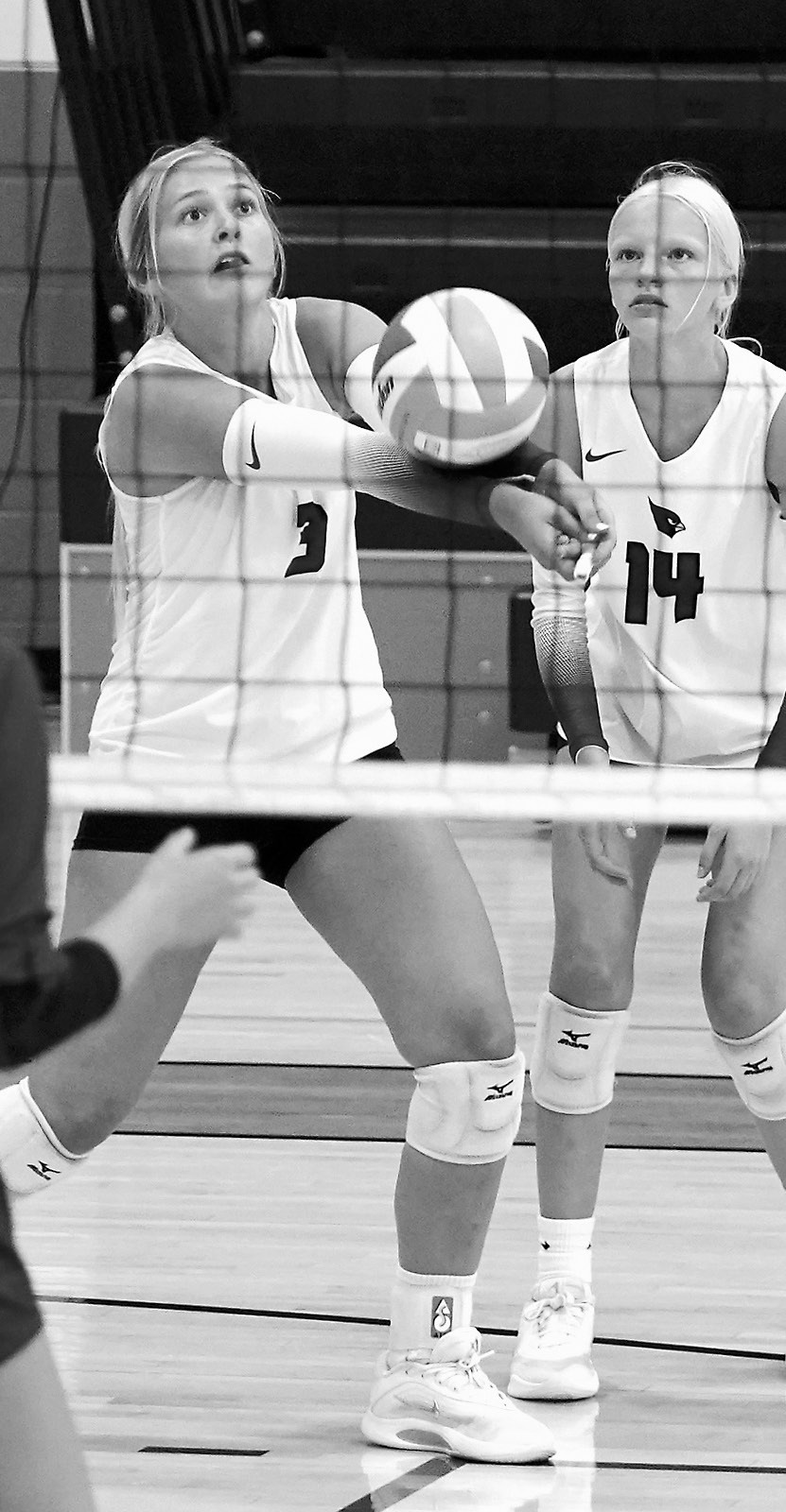 Emma Hall passes the ball to a teammate in Thompson on Aug. 23. Photo by Larry Stokke.