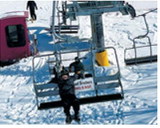 A student enjoys a sunny ride up the lift at Frost Fire. Submitted photo