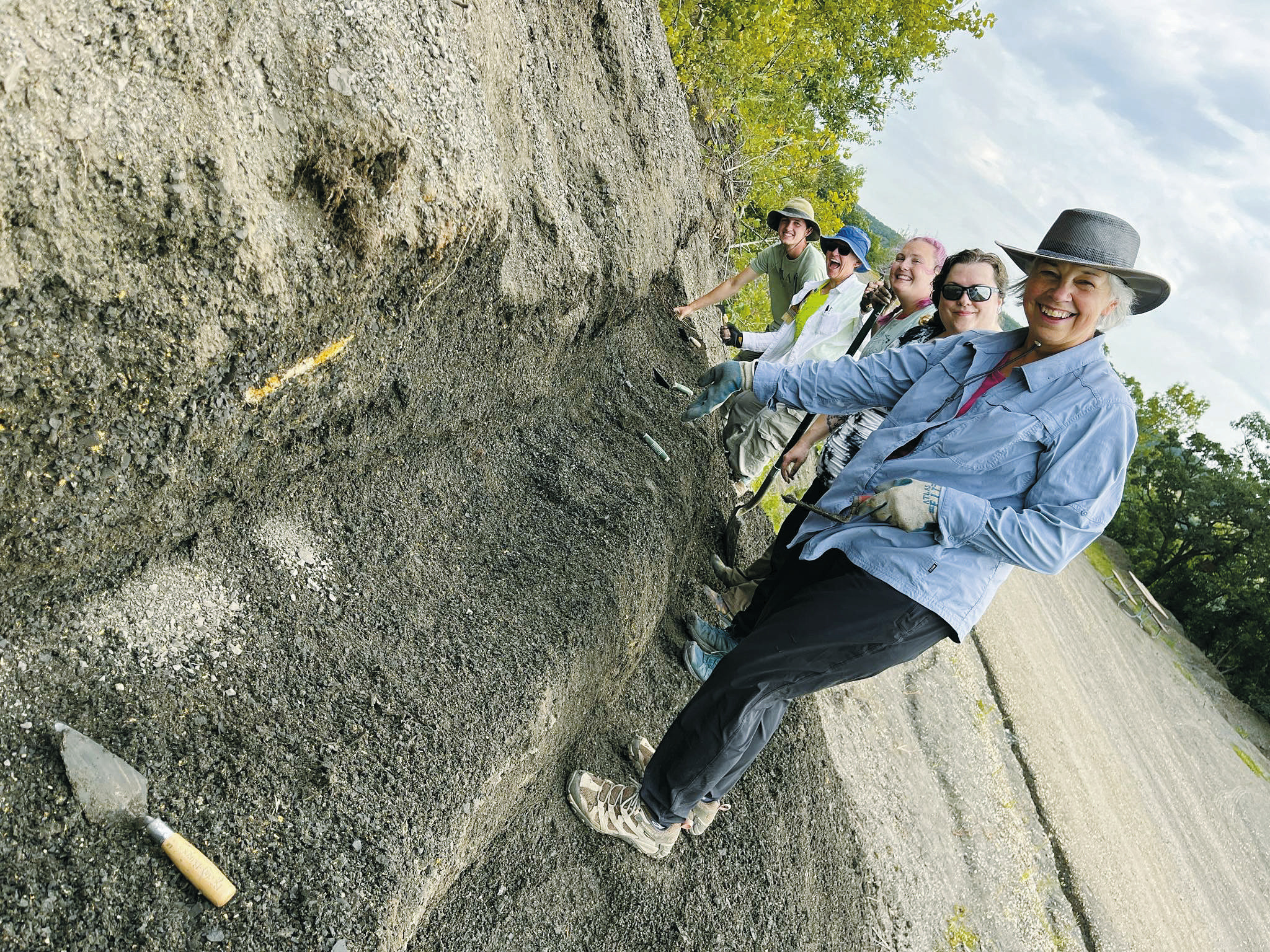 From left to right (back to front) intern Kale Link, paleontologist Cathy Lash, participants Emily Foyt, Angela Murphy, and Denise Steinbach, all working to clear off a bench of debris, while looking for weathered out fossils. Photo courtesy of N.D. Geological Survey.