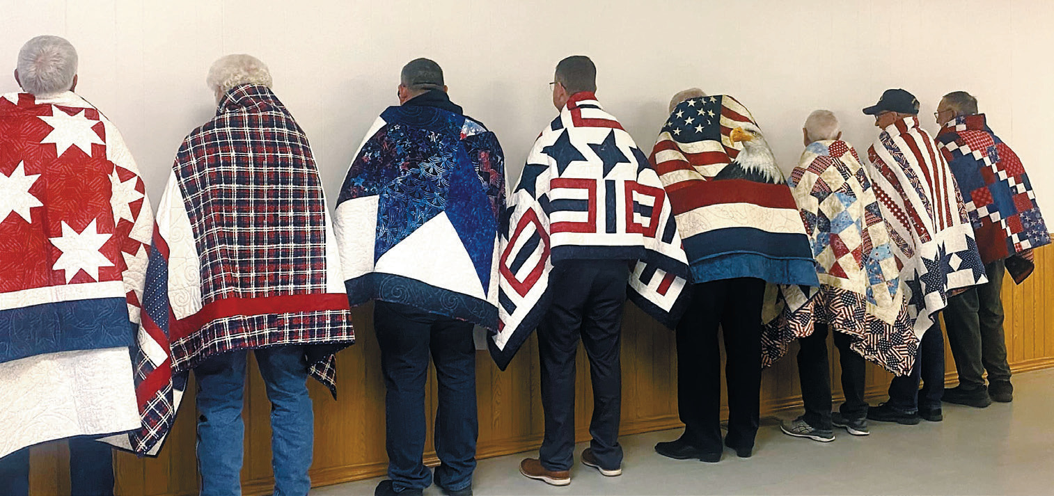The backs of the beautiful Quilts of Valor. Photo by Gael Balsdon.