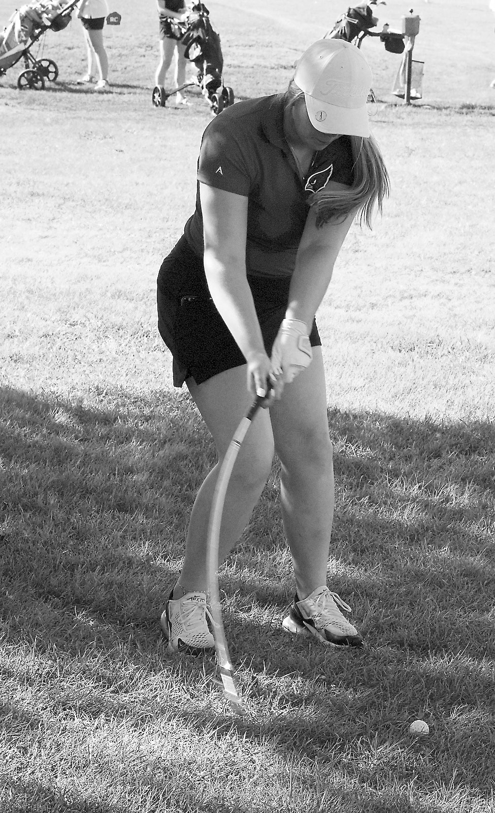 Victoria Matthews bends her club while driving the ball towards the green. Photo by Larry Stokke.