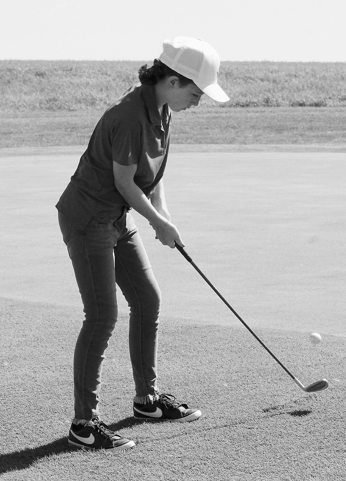 Aria Olson sends her ball up close to the pin. Photo by Larry Stokke.