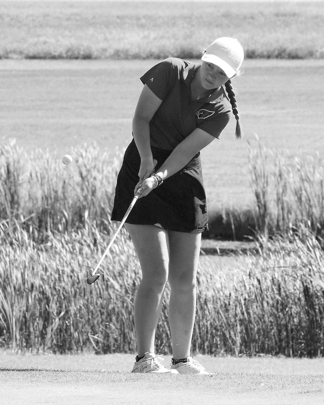 Nadia Lewis eyes her ball as she puts it up onto the green in Lakota's meet on Aug. 22. Photo by Larry Stokke.