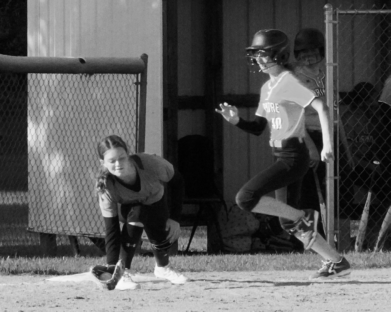 Mya Hoffman with a catch at first base, putting out a Larimore base runner. Photo by Larry Stokke.