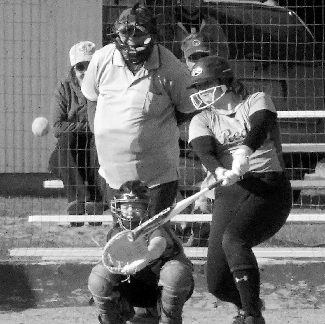 Izzie Vikan connects for a base hit against Larimore on June 23. Photo by Larry Stokke.