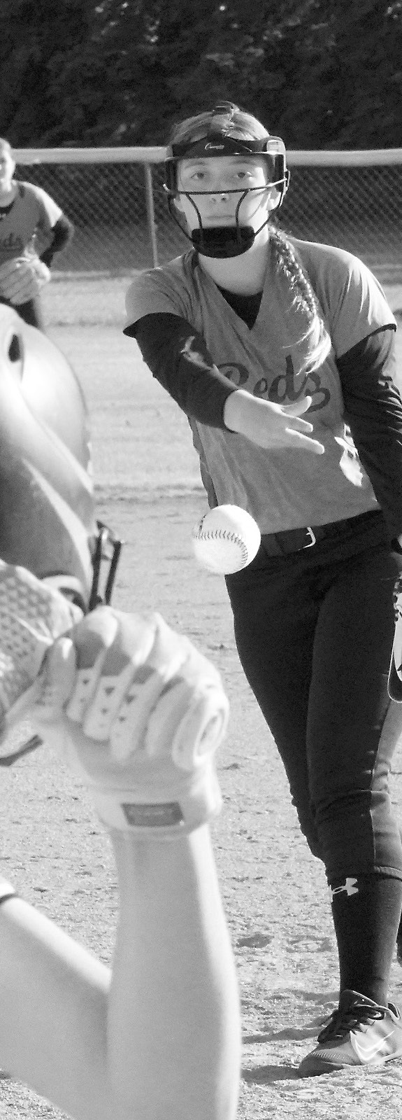 Nadia Lewis shows great concentration as she sends a strike across the plate against Larimore in Crystal June 23. Photo by Larry Stokke.