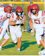 Langdon Area-Munich’s Evan Ottem carries the ball behind teammates Eastyn Schaefer, No. 2, and Caleb McDonald, No. 51, against the Oakes Tornadoes on Friday, Aug. 21. Evan was the FM Bank player of the game. Photo by Larry Stokke