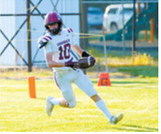 Langdon Area-Munich’s Maddux Stremick runs in for a touch down against the Oakes Tornadoes on Friday, Aug. 21, in Oakes. Photo by Larry Stokke