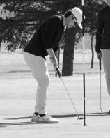 Grant Cosley sinking a putt at the Langdon Invitational. Photo by Larry Stokke.