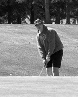 Parker Rime putts the ball up onto the green. Photo by Larry Stokke.