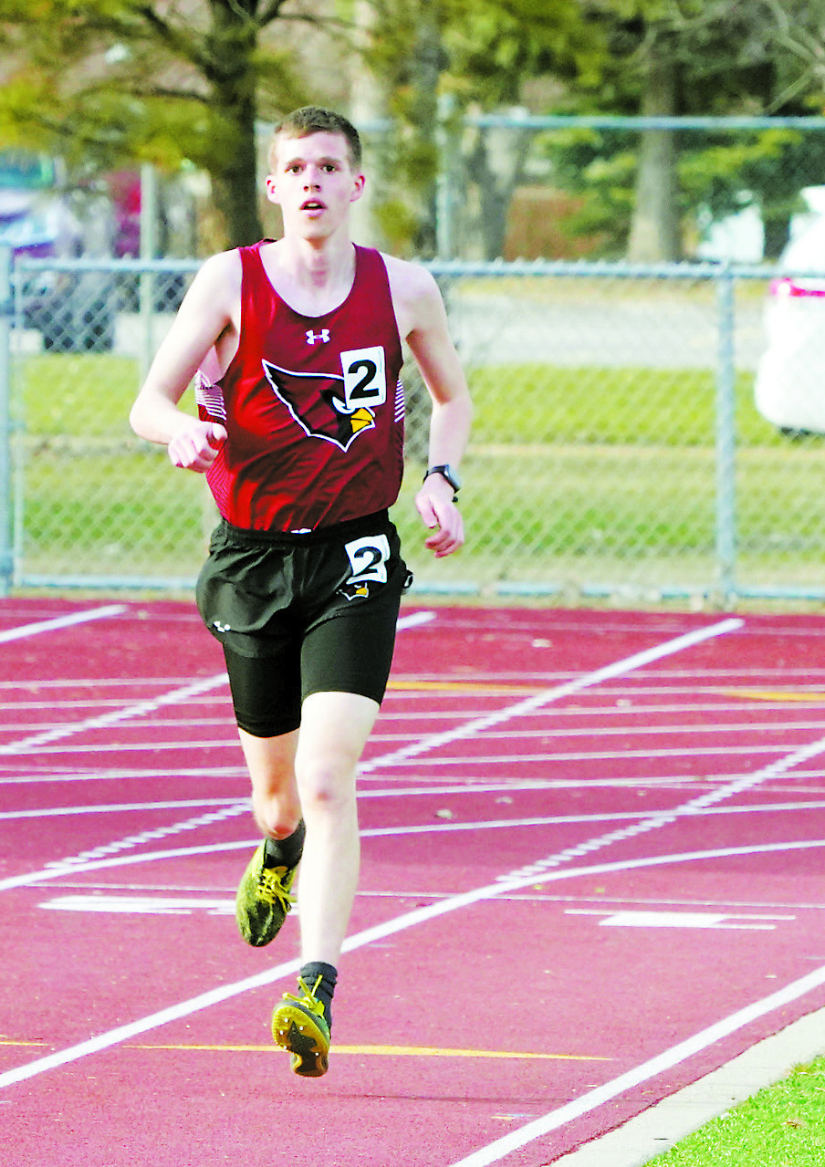 Noah Foster as he runs to a 3rd place finish in the 3,200 meter run. Photo by Larry Stokke.
