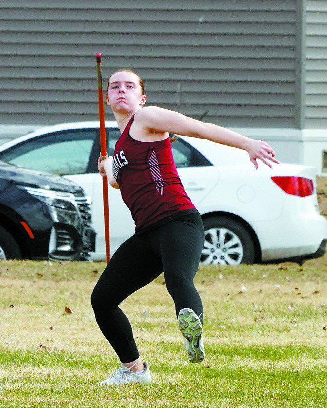 Meredith Romfo had a state qualifying throw in the Javelin with a score of 124' 9'. Photo by Larry Stokke.
