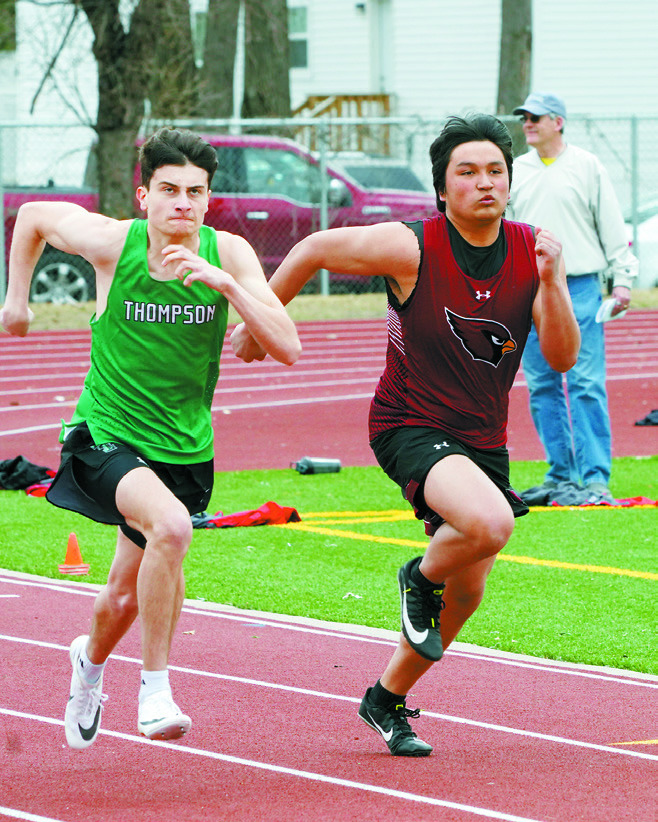 Oshun Highhawk running in the 100 meter dash in Grand Forks on April 21. Photo by Larry Stokke.