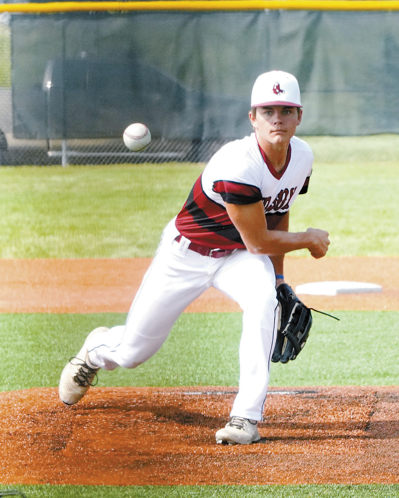 Nick Kingzett eyes the batter and sends a strike across the plate. Photo by Larry Stokke.