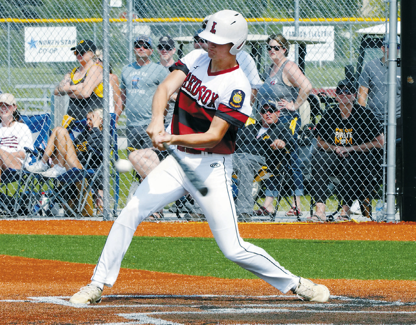 Cody Amble with a hit to get on base against Park River. Photo by Larry Stokke.