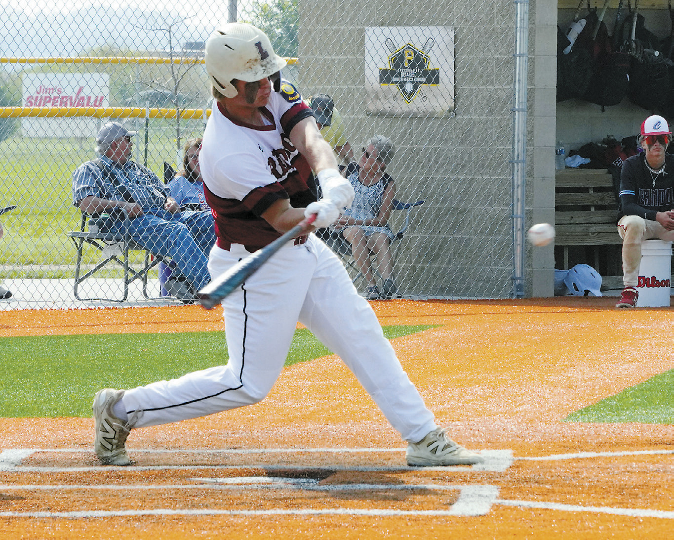 Theo Romfo, who was named Player of the Game against Cando, on his birthday, connects for a base hit. Photo by Larry Stokke.