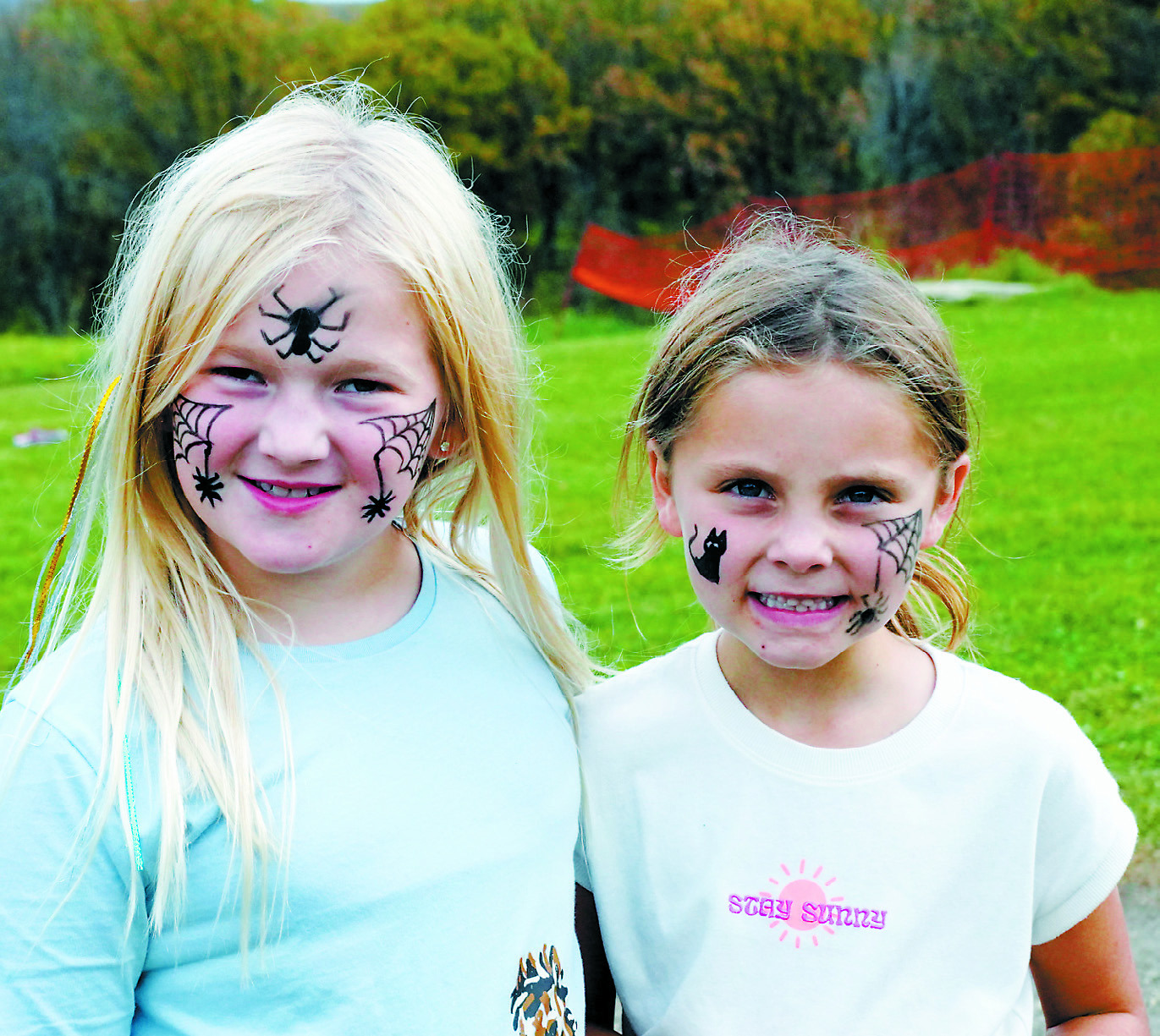 Oktoberfest attendees showing off their spooky face paint. Photo by Larry Stokke.