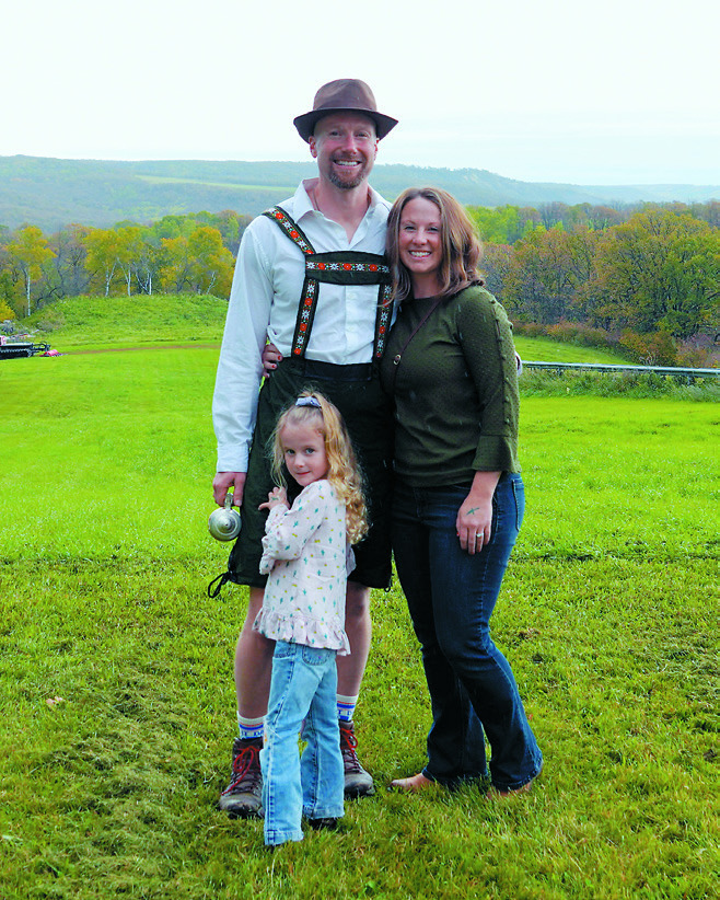 Kyle and Lyndsey Switzer with their daughter enjoying Frost Fire's Oktoberfest. Photo by Larry Stokke.