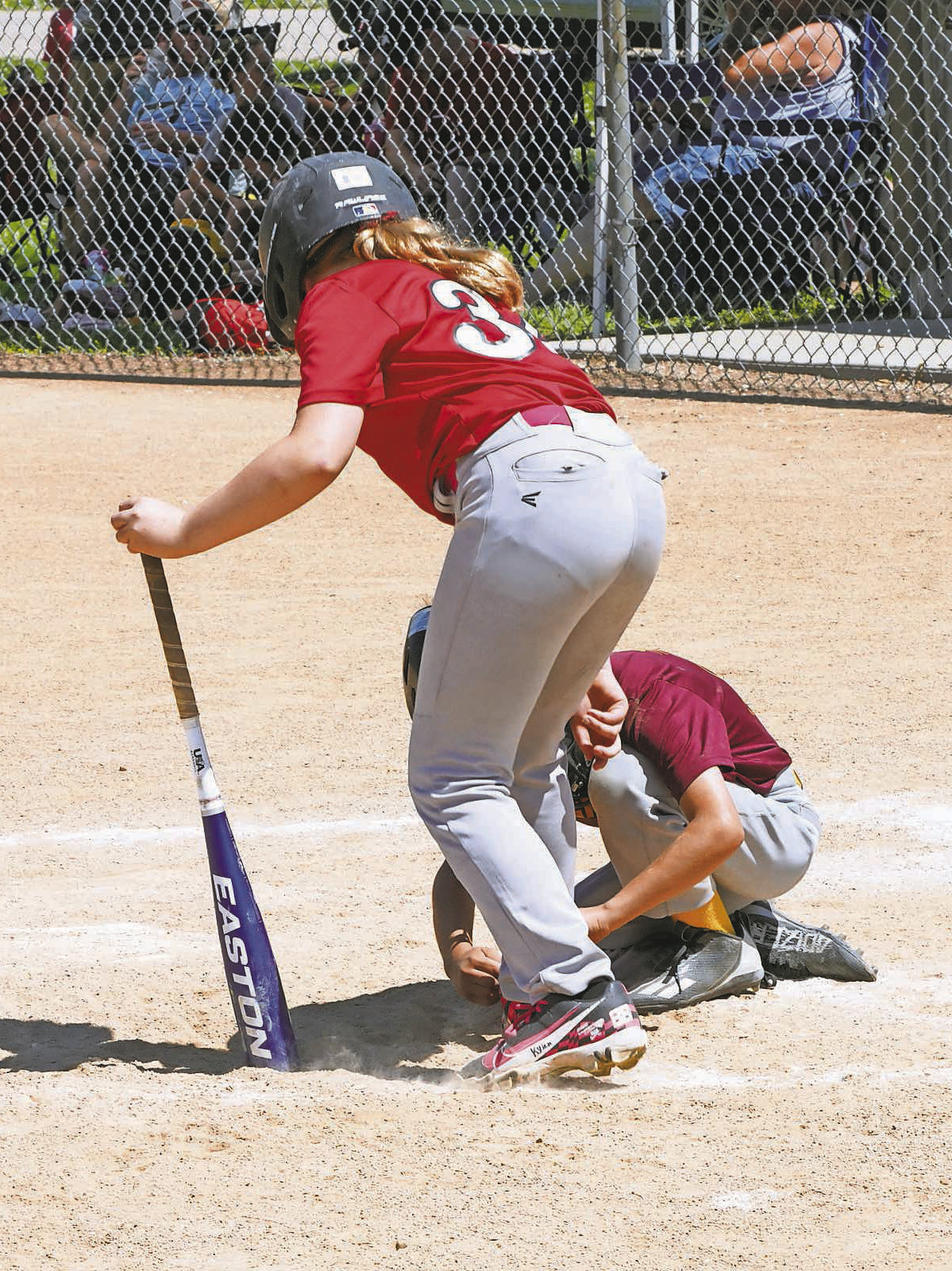 Logan Vollrath from Cavalier impressed attendees with a simple gesture of kindness – tying a fellow athlete, Kylah McKay’s shoe for her mid game. Photo by Larry Stokke.