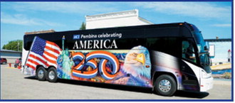 Motor Coach Industries' patriotic coach bus rolls through Pembina during the community's Fourth of July parade. The bus, wrapped in an America 250-themed design featuring patriotic imagery, helped celebrate the nation's upcoming 250th birthday while showcasing Pembina's role in the nationwide commemoration. Photo by Larry Stokke
