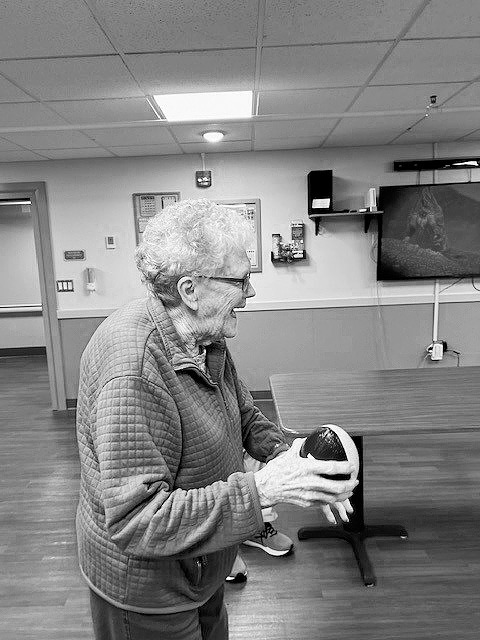 Georgie playing football toss.