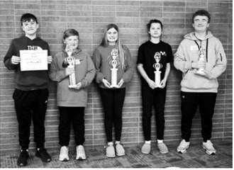 Cavalier County Spelling Bee L-R Written Vocabulary Test Winner Alex Bott from Langdon Middle School, 1st Place and State Qualifier Finley Smith from LAEM, State Qualifier 2nd Place Paisley Feil from LAEM, 3rd Place Finley Gage from Munich Public School, 4th Place Tristan Thompson from St. Alphonsus School. Photo by Larry Stokke