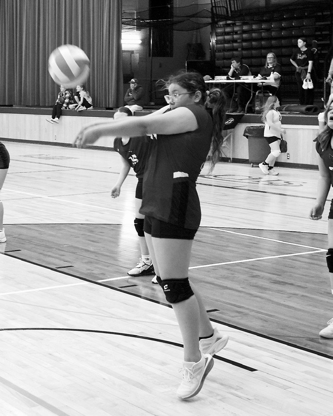 Kayanna Petri bumps the ball to a teammate in the game against the Spoilers. Photo by Larry Stokke.