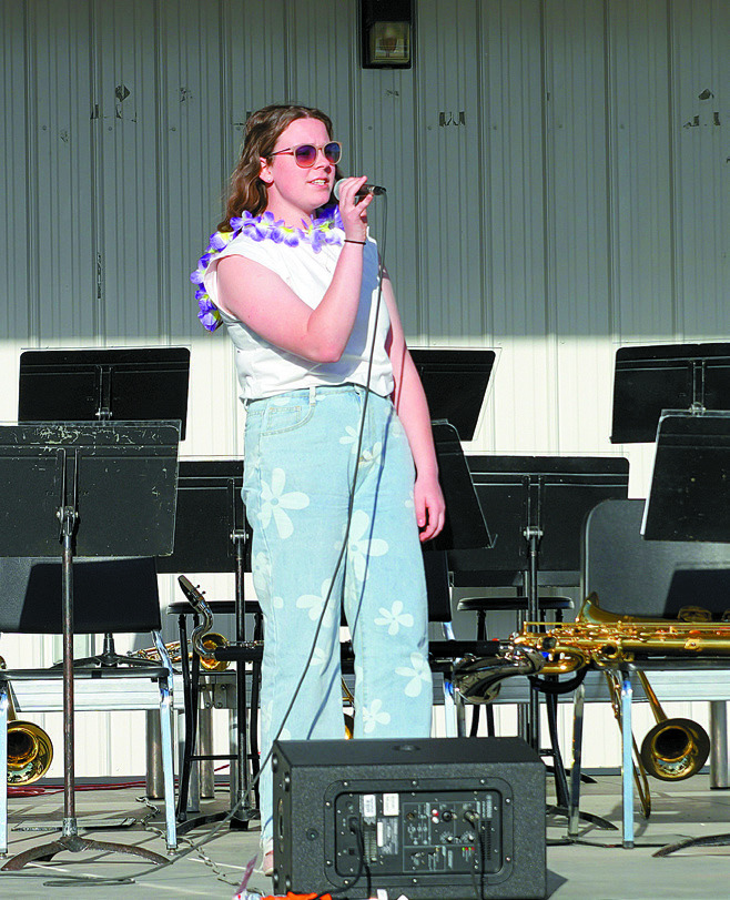 Madilyn Crump singing at Boyd Block. Photo by Larry Stokke.
