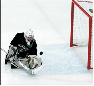 Ryder Moser eyes the puck and warns it to stay out of his net. Apparently, it worked as Ryder had two shutouts over the weekend. Photo by Larry Stokke.