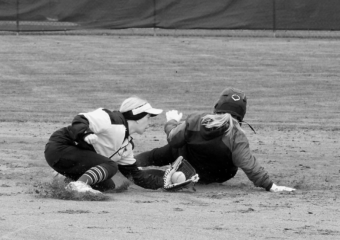 Raeleigh Ratzlaff slides safely into second base in Thompson on May 17. Photo by Larry Stokke.