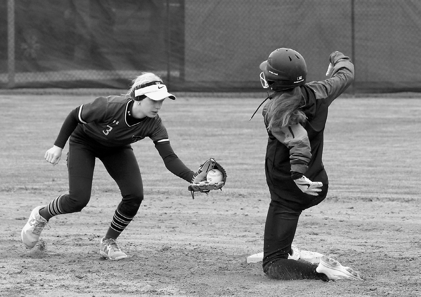 Lily Zimmer beats the ball to the plate to get safely on base. Photo by Larry Stokke.
