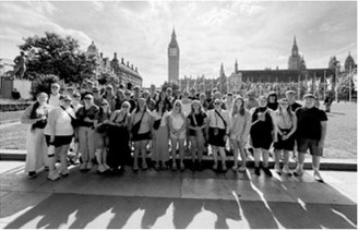 Matilda Lawson’s bus group gathers in front of Big Ben at the Palace of Westminster in London. Submitted photo