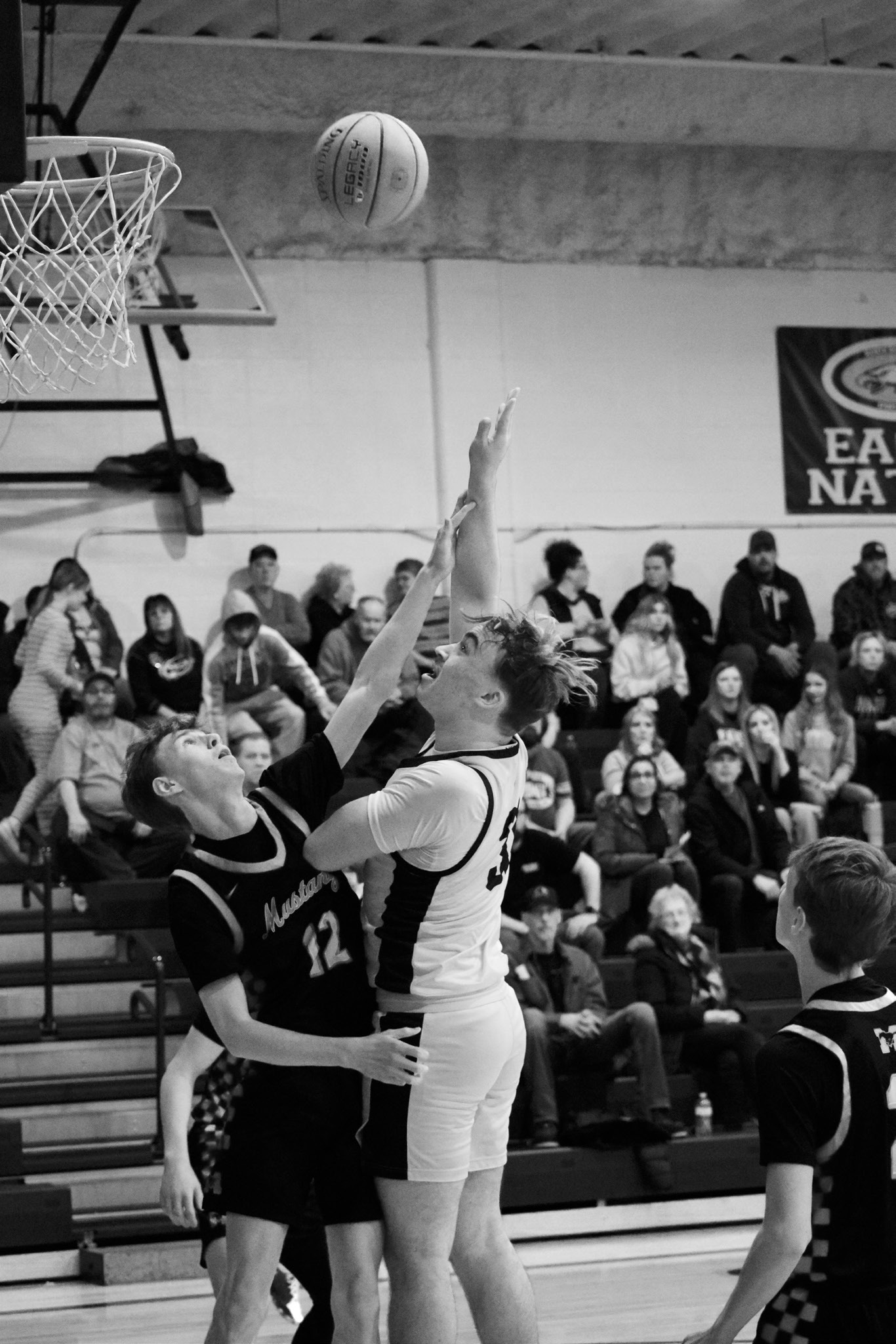 Kade Schafer leaps for the bucket against the Mustangs. Photo by Ashley Schafer.