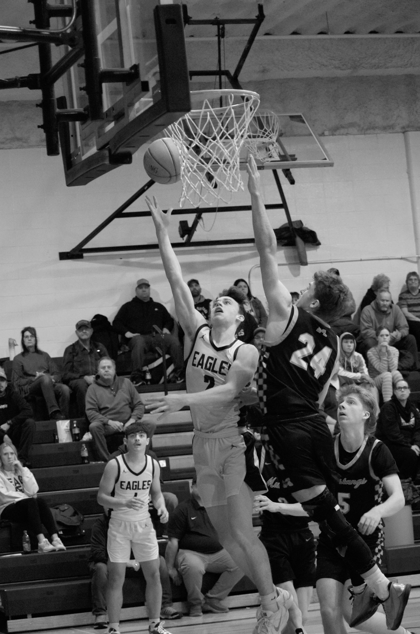 Kaden Moore drops in a layup in the Eagles’ game against the Mustangs. Photo by Ashley Schafer.