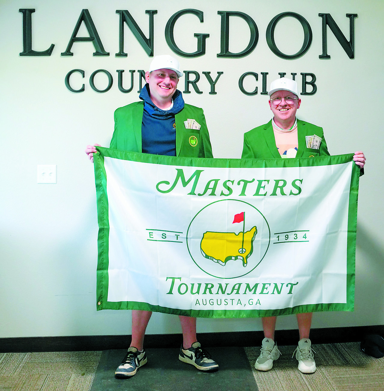 Winners of the tournament, James Childress and Jason Askvig, pose in their Masters green jackets. Photo by Larry Stokke.