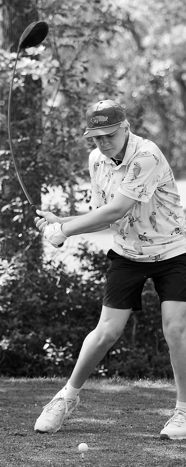 Kennen Forest puts a bend in his swing as he tees off. He will represent the Cards at state golf. Photo by Larry Stokke.
