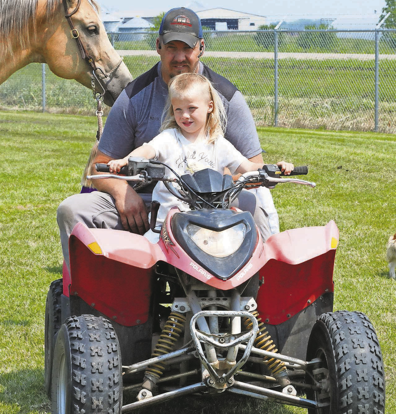 A 4Her takes a four-wheeler ride while in Hamilton for the 4H Horse Show. PHOTO BY LARRY STOKKE.