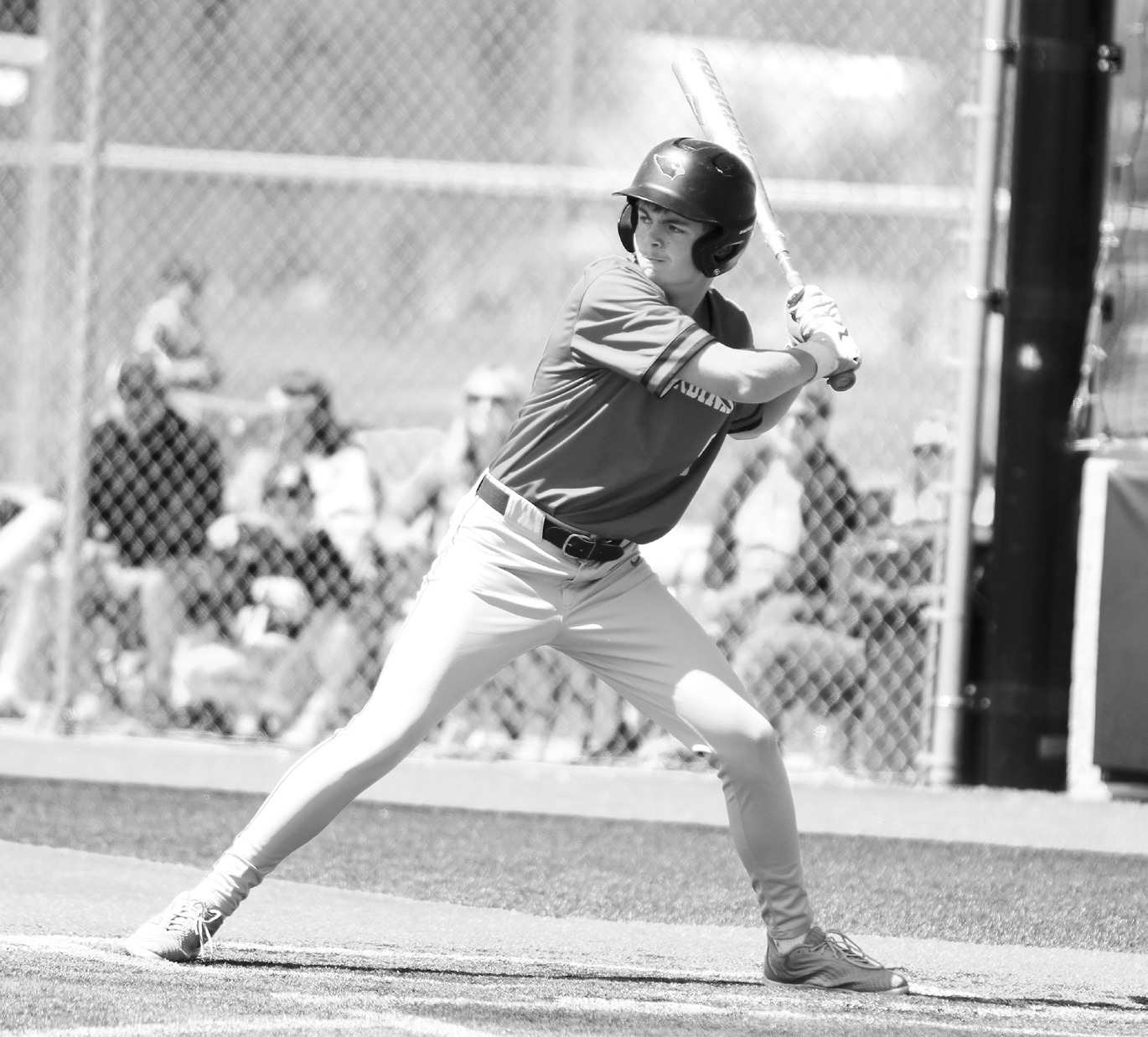 Dawson Downs eyes the pitcher waiting for the ball. Photo by Chelsea Wysocki/The Walsh County Record.